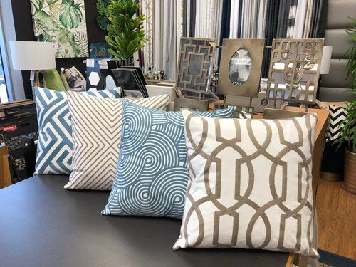 A group of pillows sitting on top of a table.